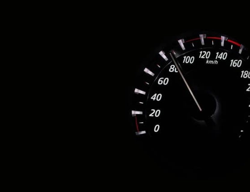 A speedometer approaching 100 km/h